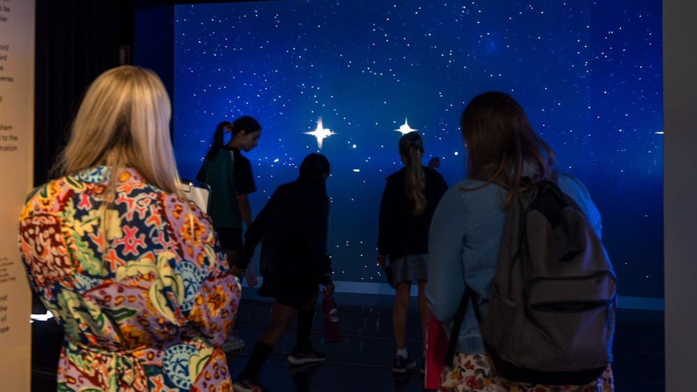 Young people interacting with Gravitational Weave at Outer Space