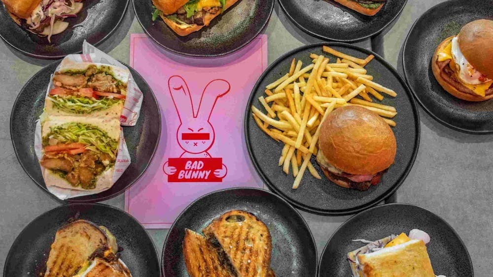 Image of various Bad Bunny food offerings: sandwiches, wraps, toasties and shoestring fries.
