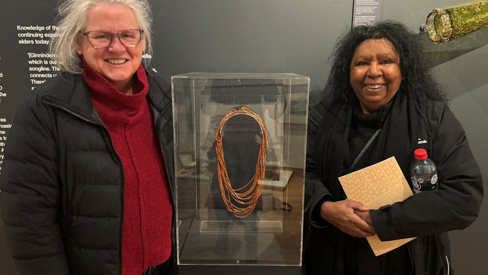 Dr Robyn McKenzie and Maree Clark at CMAG with one of Maree's artworks