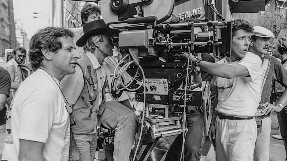 Black and white image of camera people all participating in shooting