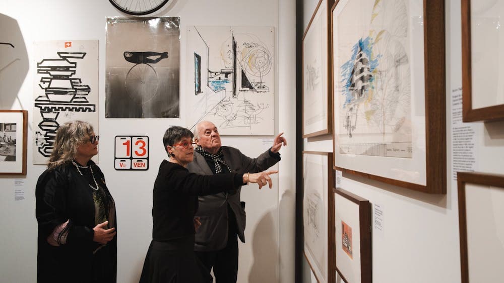 People exploring the Taglietti exhibition