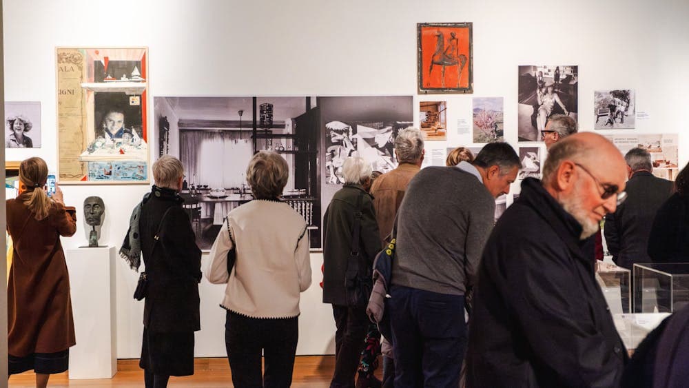 People exploring the Taglietti Exhibition