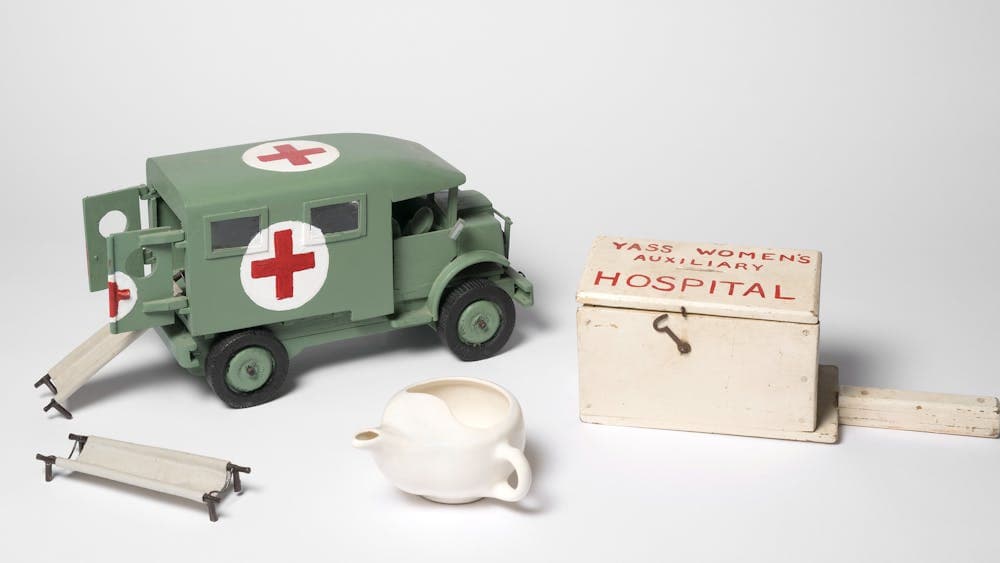 WWII Collectibles, medic truck, tea pot, miniature gurney and box