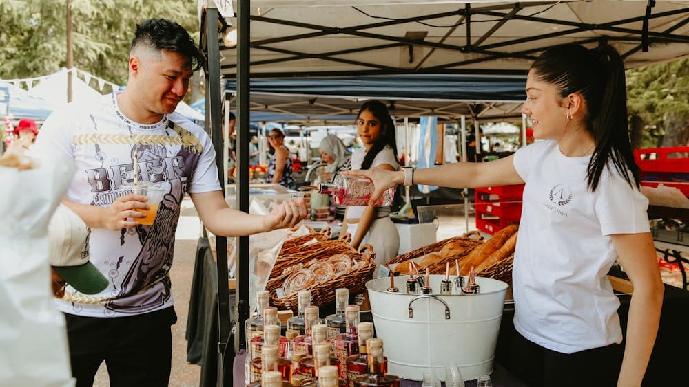 A visitor tasting a sample of vodka from Ambrosia Distillery