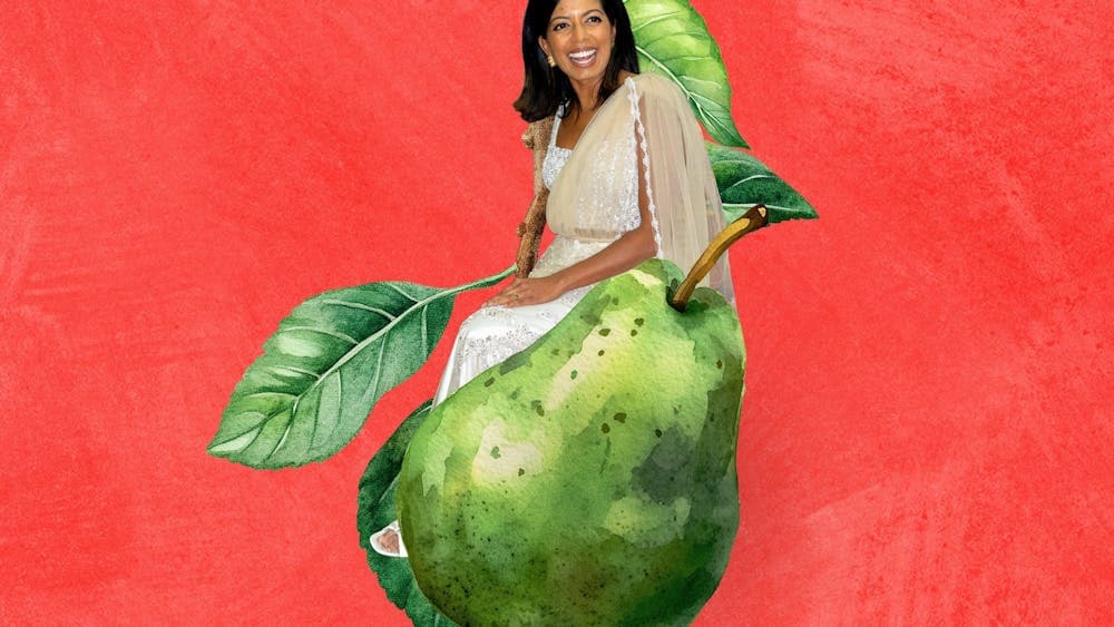 Sashi Perera sitting on a pear in a pear tree