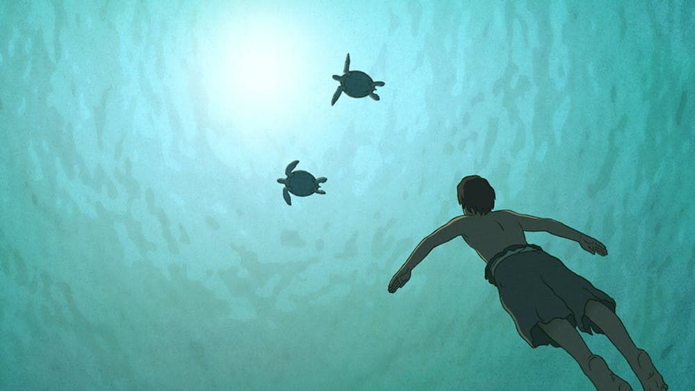 Animation of two turtles underwater and a boy swimming towards them