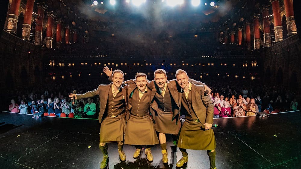 Celtic Thunder smiling on stage