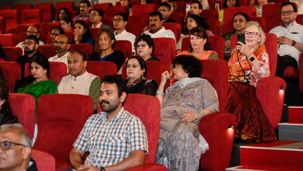 Audience seated inside the cinema