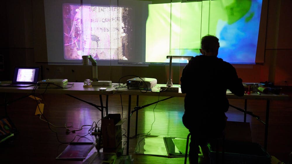 musician in from of colourful background