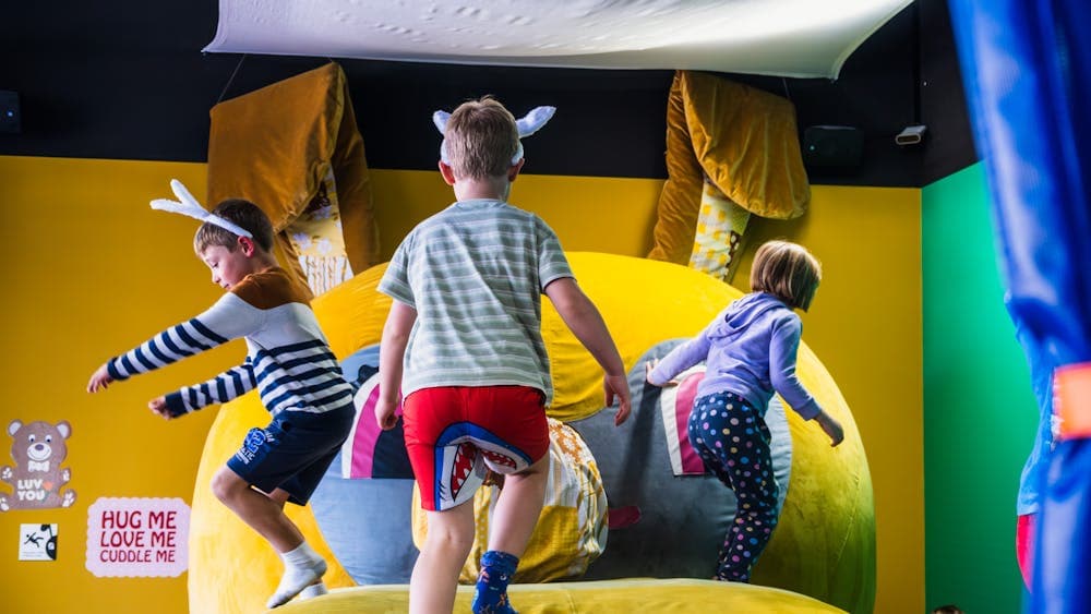 3 children playing on Bunny Dearest