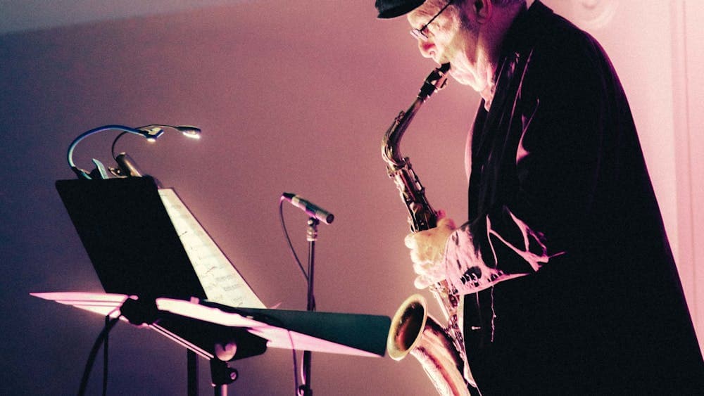 Pictured is Phillip Johnston performing with his saxophone