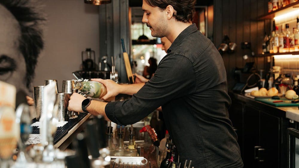 Staff behind the bar at PJs in the City