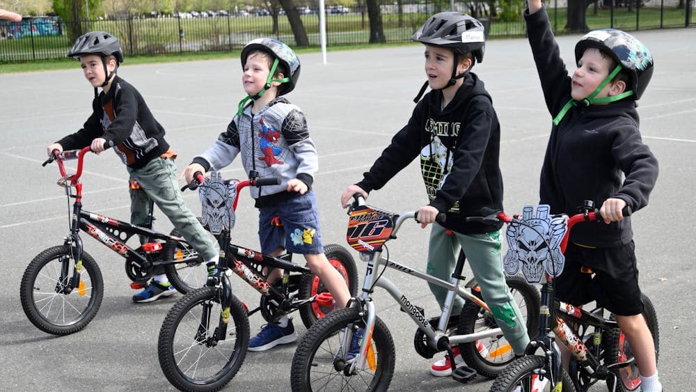 Four young boys with their bikes