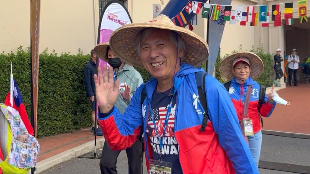 Taiwanese man waving at the start