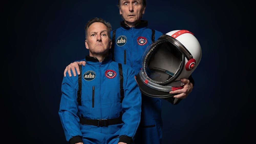 Comedians Colin Lane and Frank Woodley posing for a photo dressed as astronauts