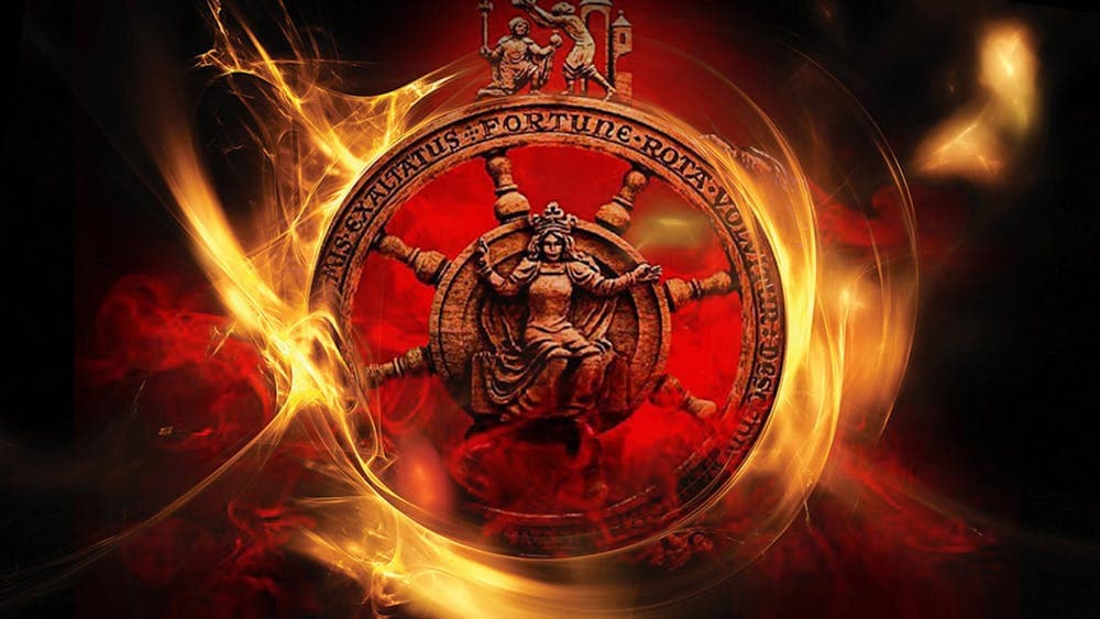 Lady Fortune in centre of fiery, spoked wheel with one figure crowning another at the top.
