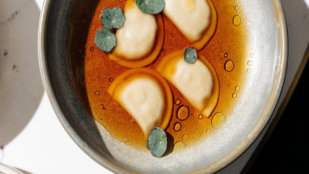 Ravioli — Shiitake Broth, Truffle Oil, Nasturtium