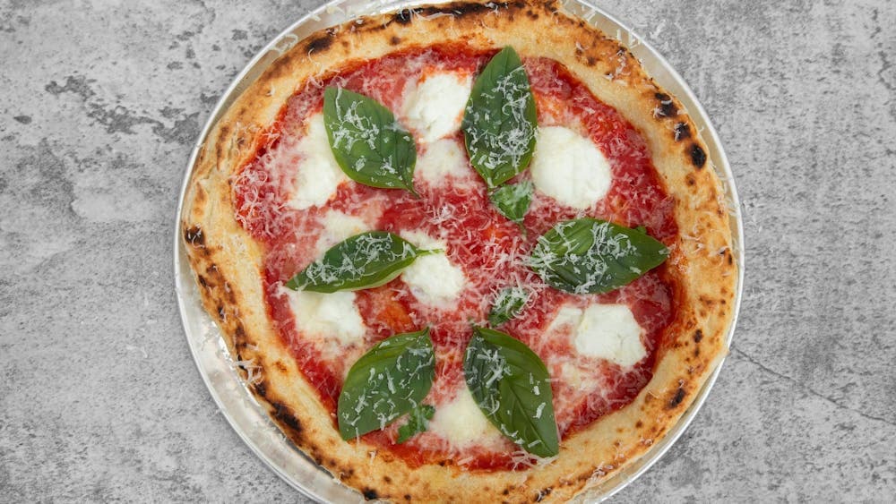 San Marzano Tomatoes, Fior de latte, Basil, oregano finish with grated Parmesan cheese