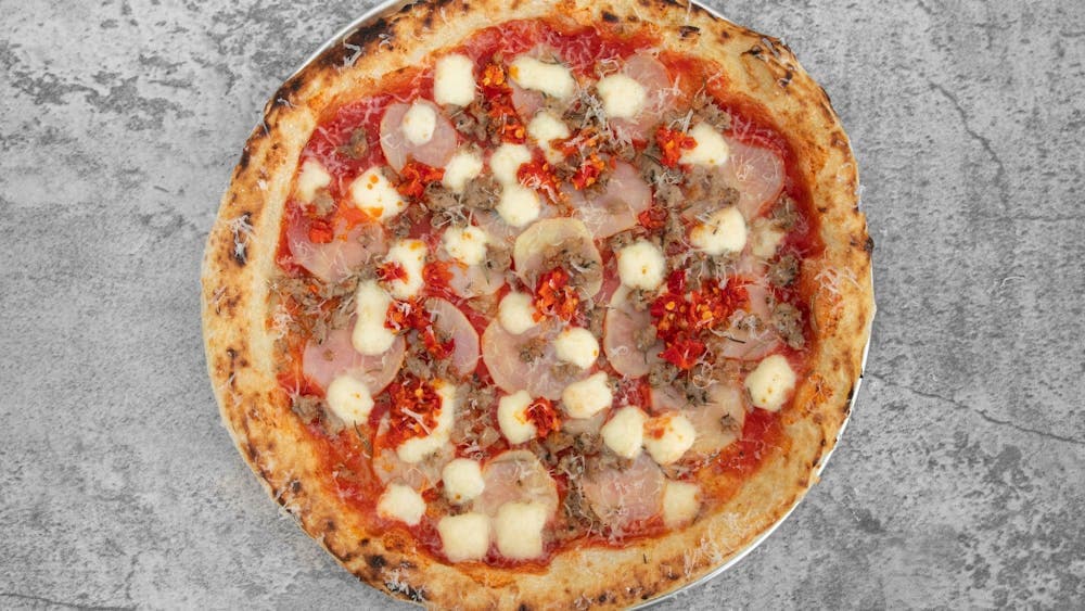 San Marzano Tomatoes, Fior de latte, Italian sausage, Potato, Rosemary, finish with Spicy Hot Pepper