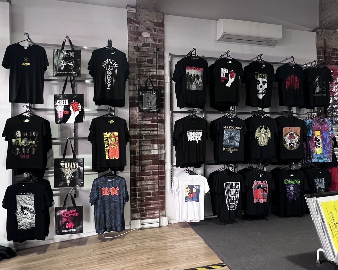 Shop wall with band tshirts on display