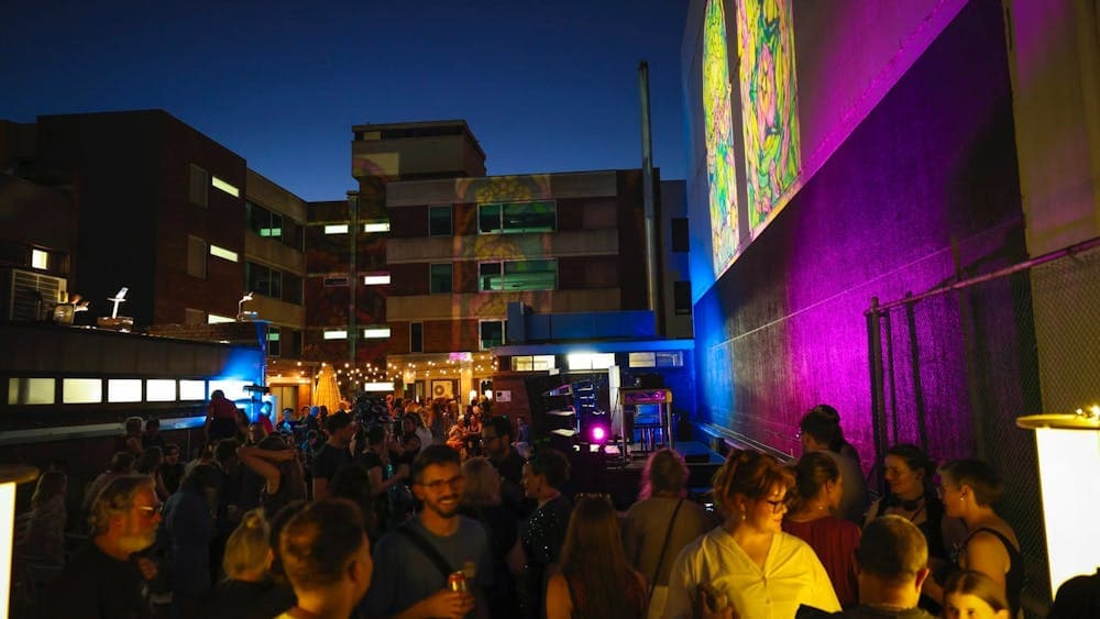 People enjoying the rooftop space a Blank Cultural Platform launch event.