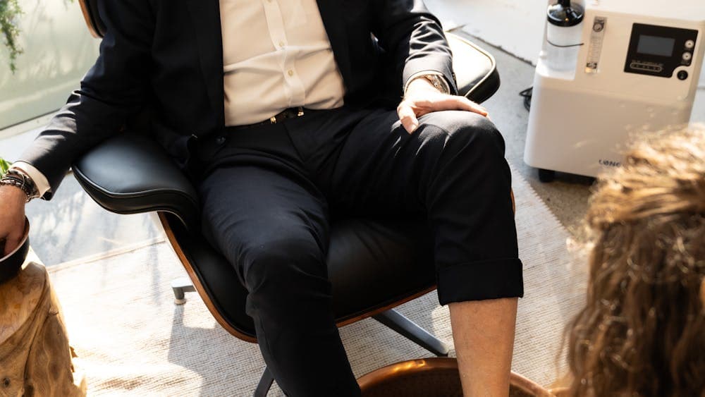 A client enjoying a Executive Pedicure at FANAEIANS Barber & Spa