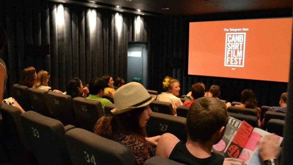 Cinema Screen showing CSFF logo with audience watching from right side