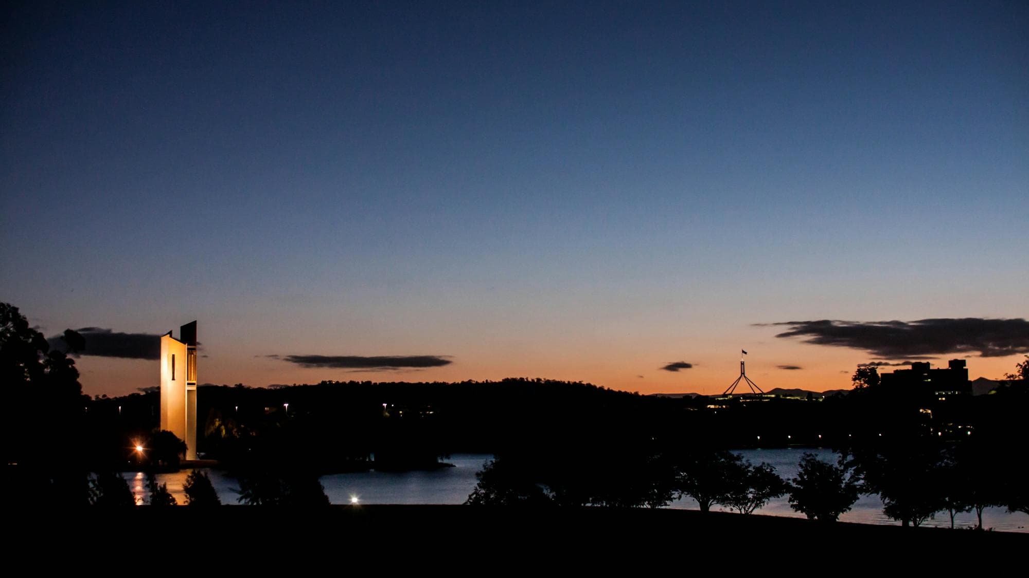 Canberra at sunset showing the Carillon bell tower and Parliament House