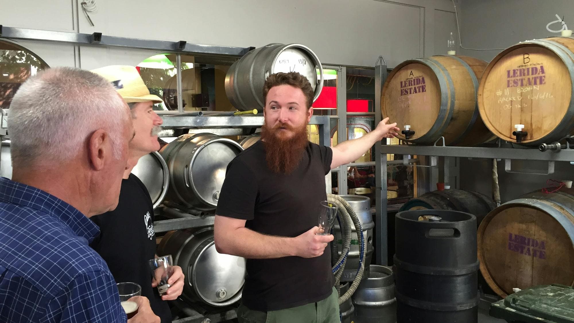 Men in the barrel room at Wig & Pen
