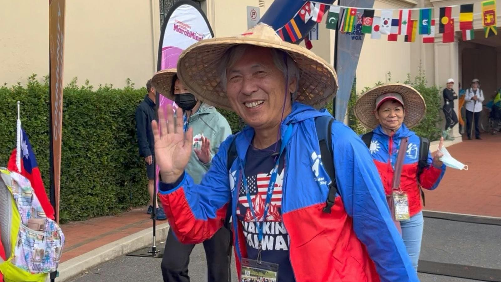 Taiwanese man waving at the start