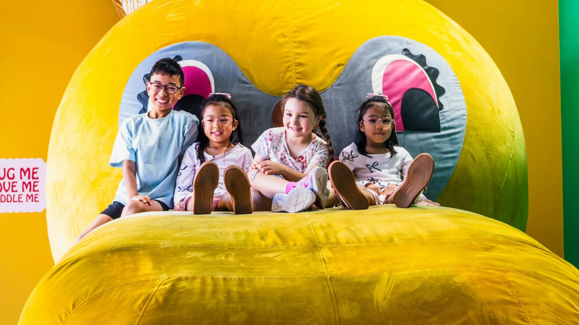 Four children relaxing on Bunny Dearest