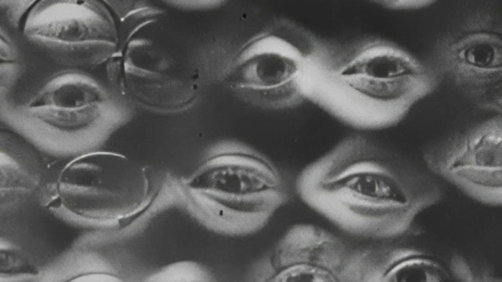 Black and white image of many human eyes