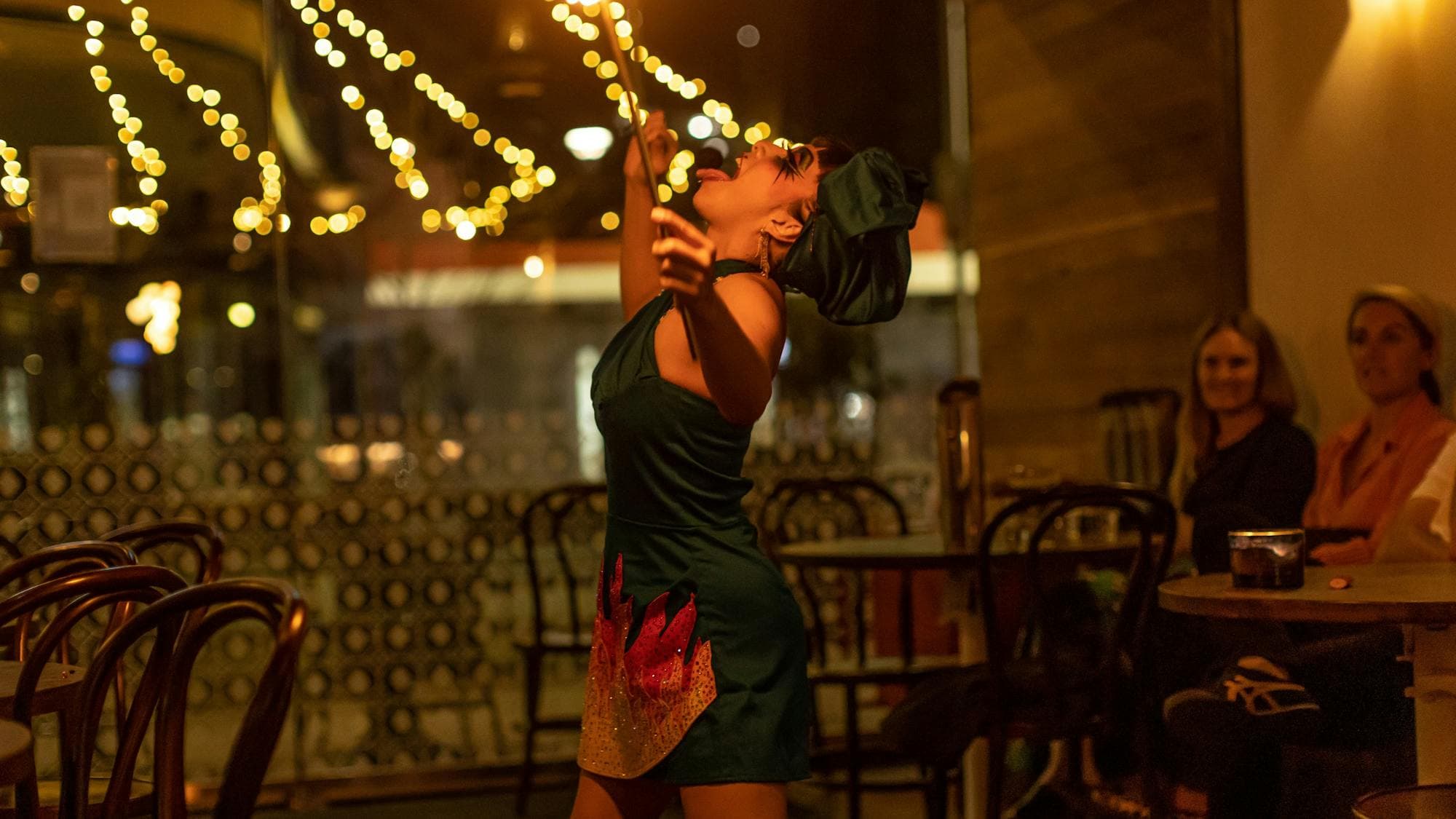 performer eats fire at Bar Beirut